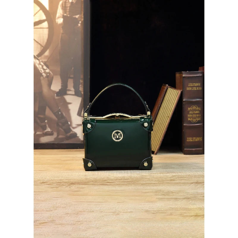 Vintage-style women's handbag in a suitcase design, patent leather, glossy wine red, luxury high-end crossbody shoulder bag
